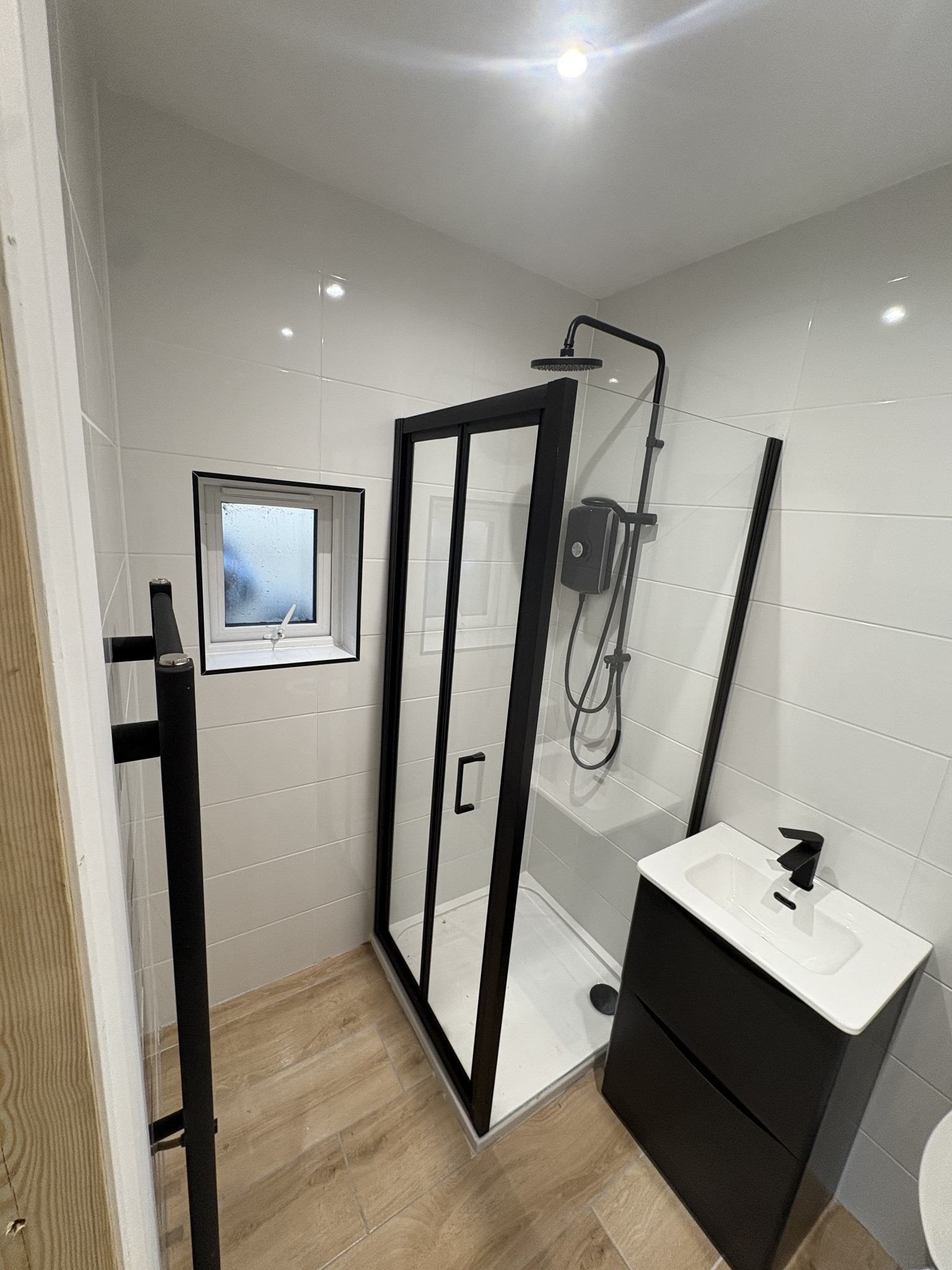 Modern bathroom with shower and tiling in East Cork
